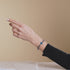 St. Ambrosia | .925 Sterling Silver | Turquoise Firefly Glass x Holographic Freshwater Pearl Cross Bracelet